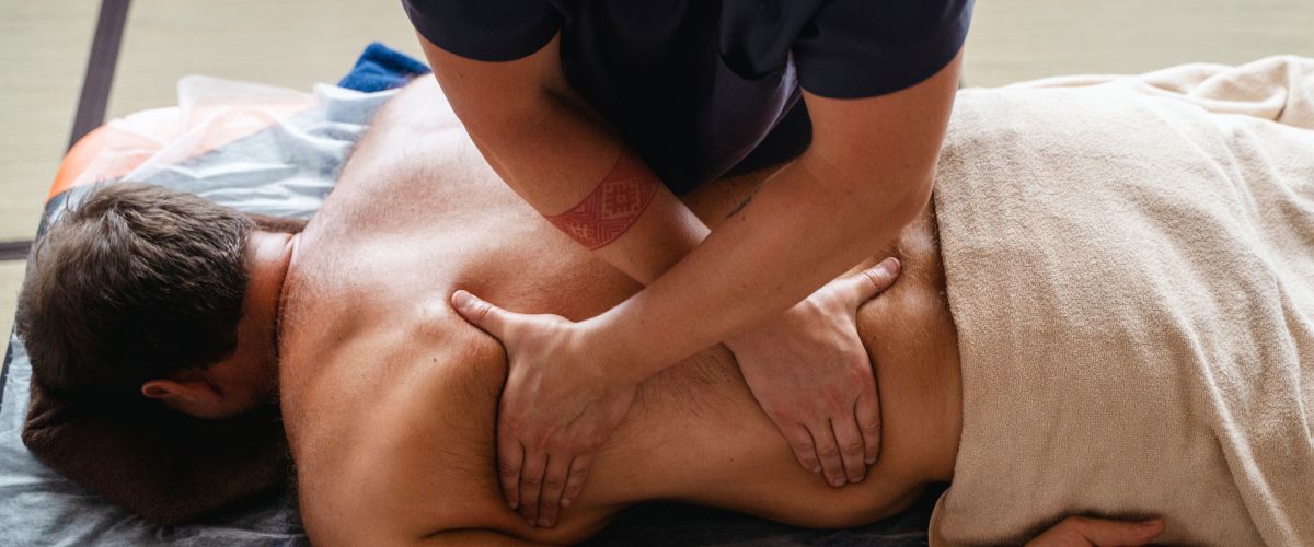 Physiotherapist giving a massage to an athlete