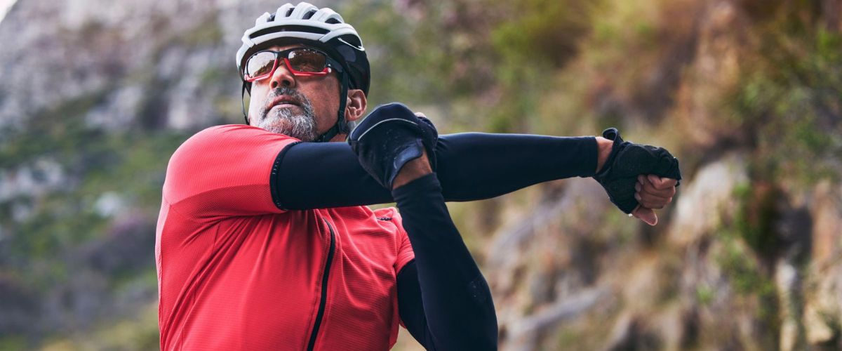 Cyclist stretching in preparation for a ride